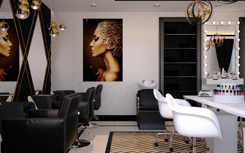 Modern salon interior featuring stylish black and white decor, a prominent artistic portrait of a woman, and salon chairs, emphasizing a sophisticated atmosphere for client services and financial management solutions.